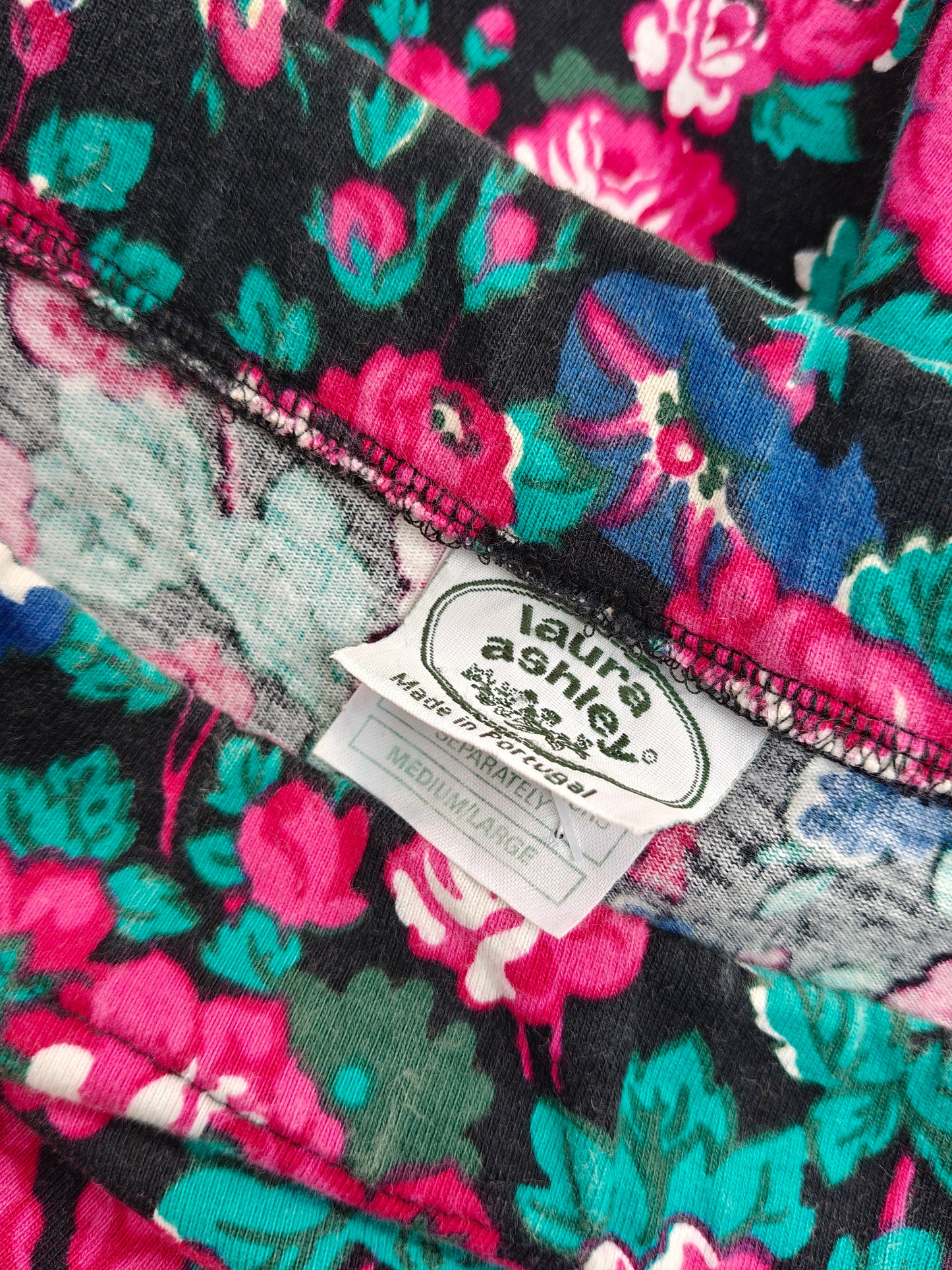 Floral fabric with a visible label on a black background
