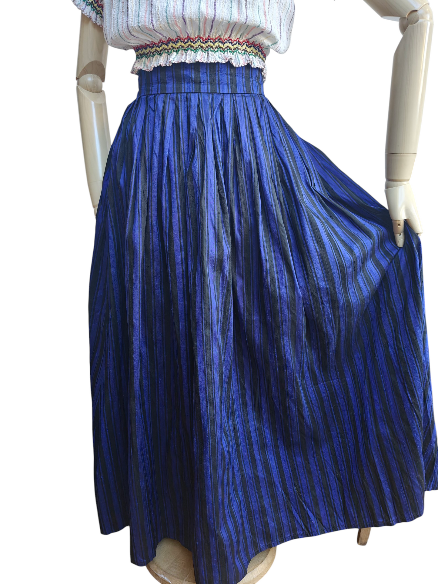 Mannequin wearing a blue striped skirt on a white background