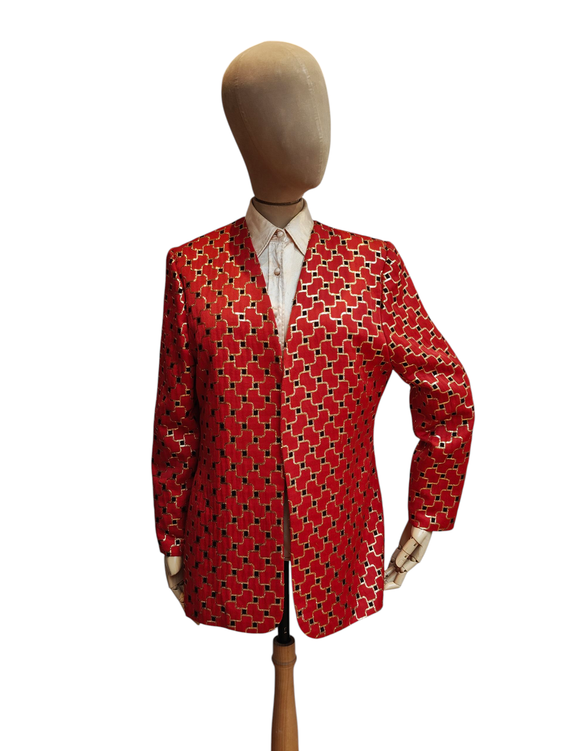 Red patterned jacket on a mannequin against a white background