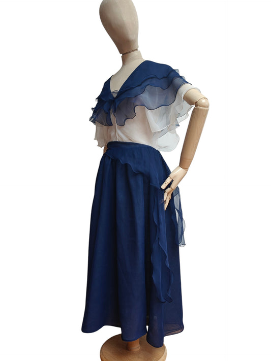 Mannequin wearing a blue and white dress on a white background
