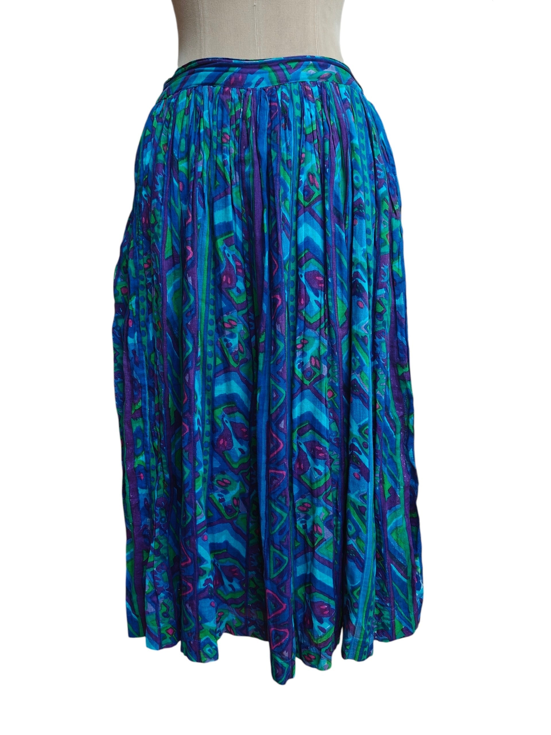 Blue patterned skirt on a mannequin against a white background