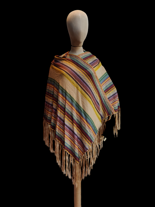 Vintage knitted poncho in rainbow stripe