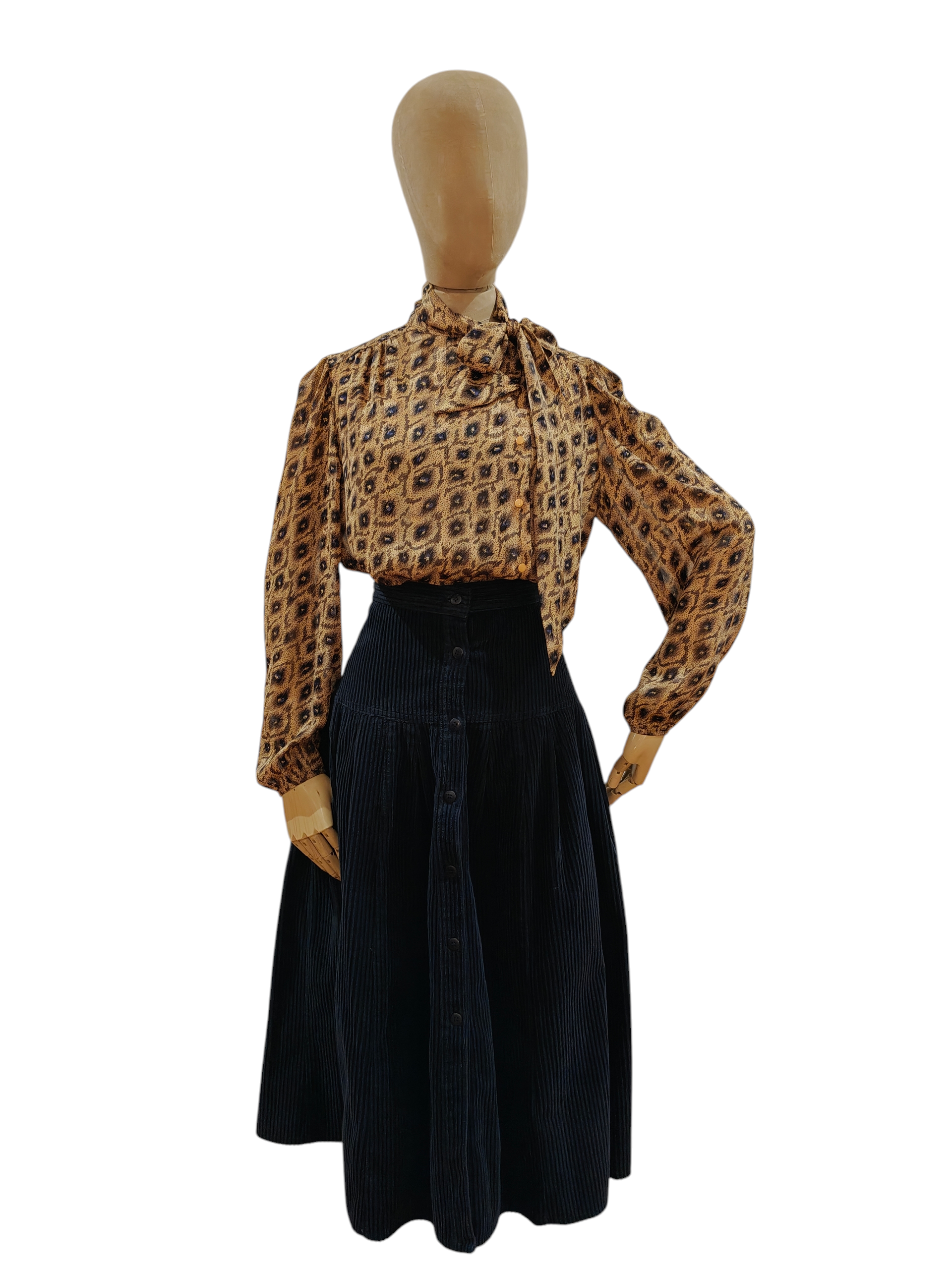 Vintage pussy bow shirt tucked into a skirt