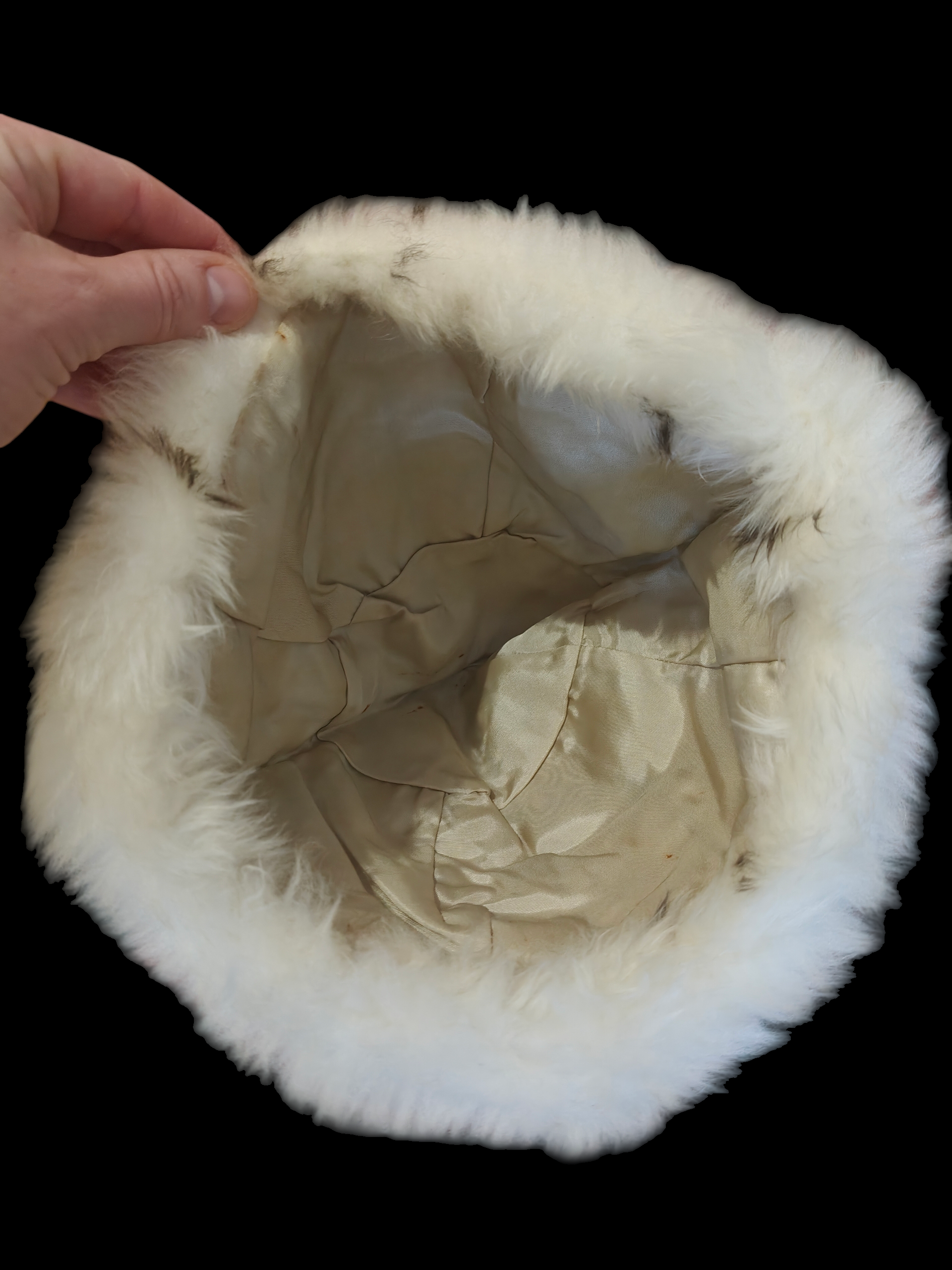 inside of white faux fur hat with lining