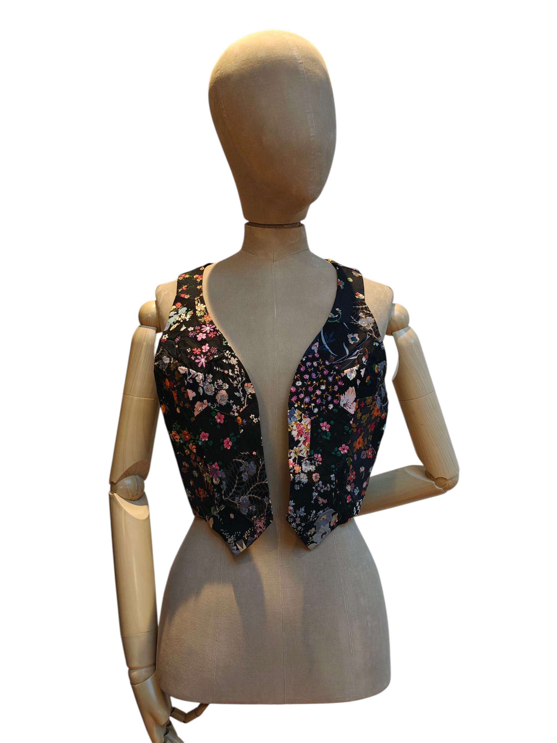 Floral patterned vest on a mannequin against a white background