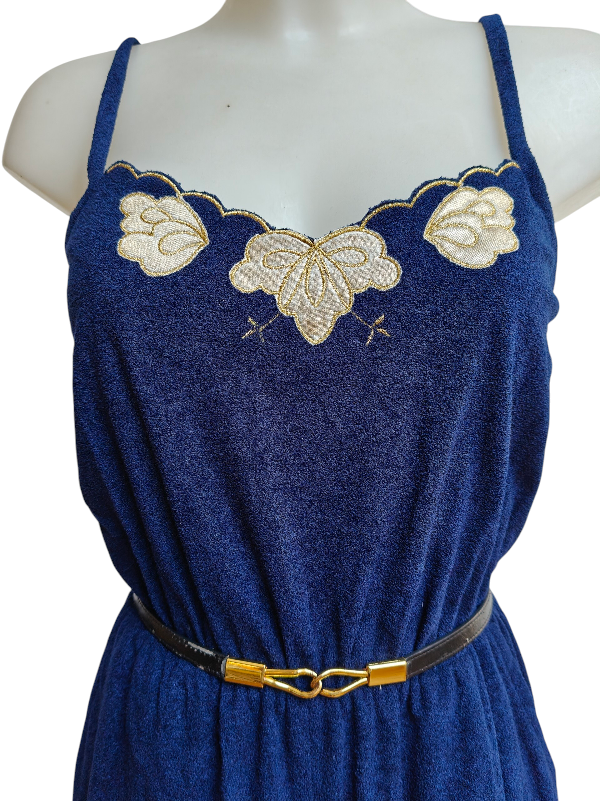 blue vintage jumpsuit with gold flower applique