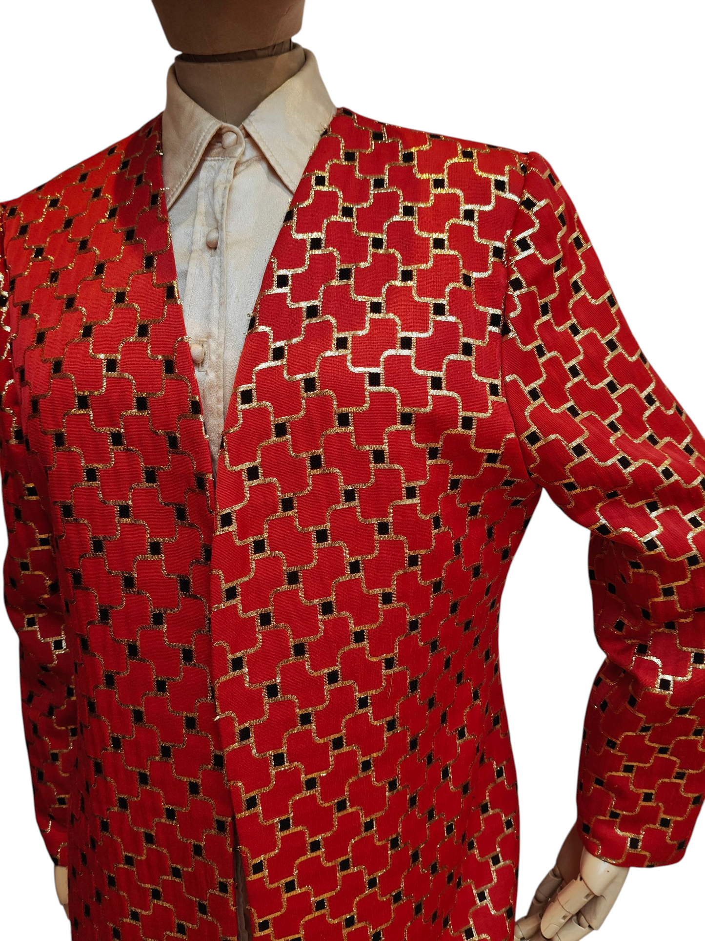 Red patterned jacket on a mannequin with a white shirt underneath