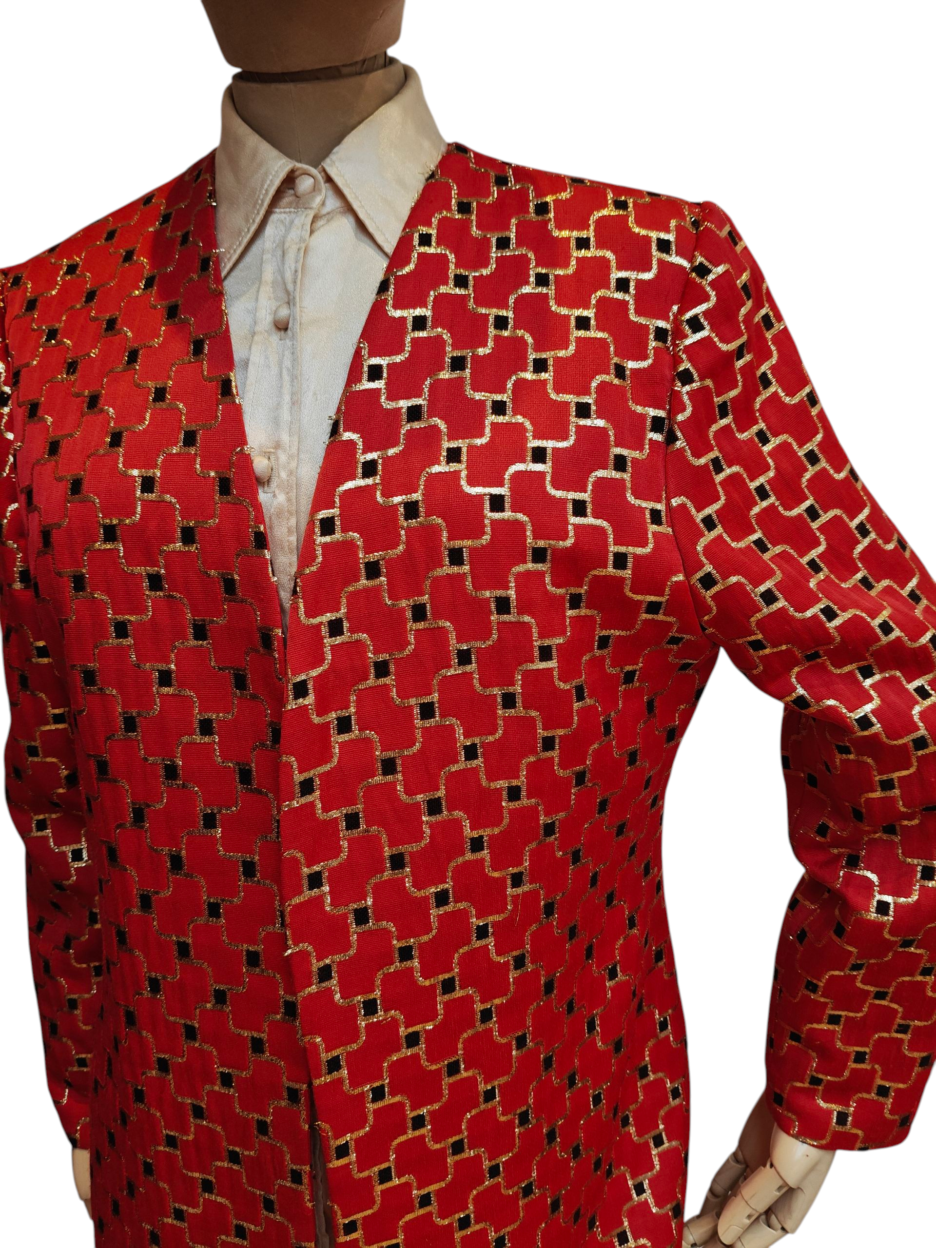 Red patterned jacket on a mannequin with a white shirt underneath