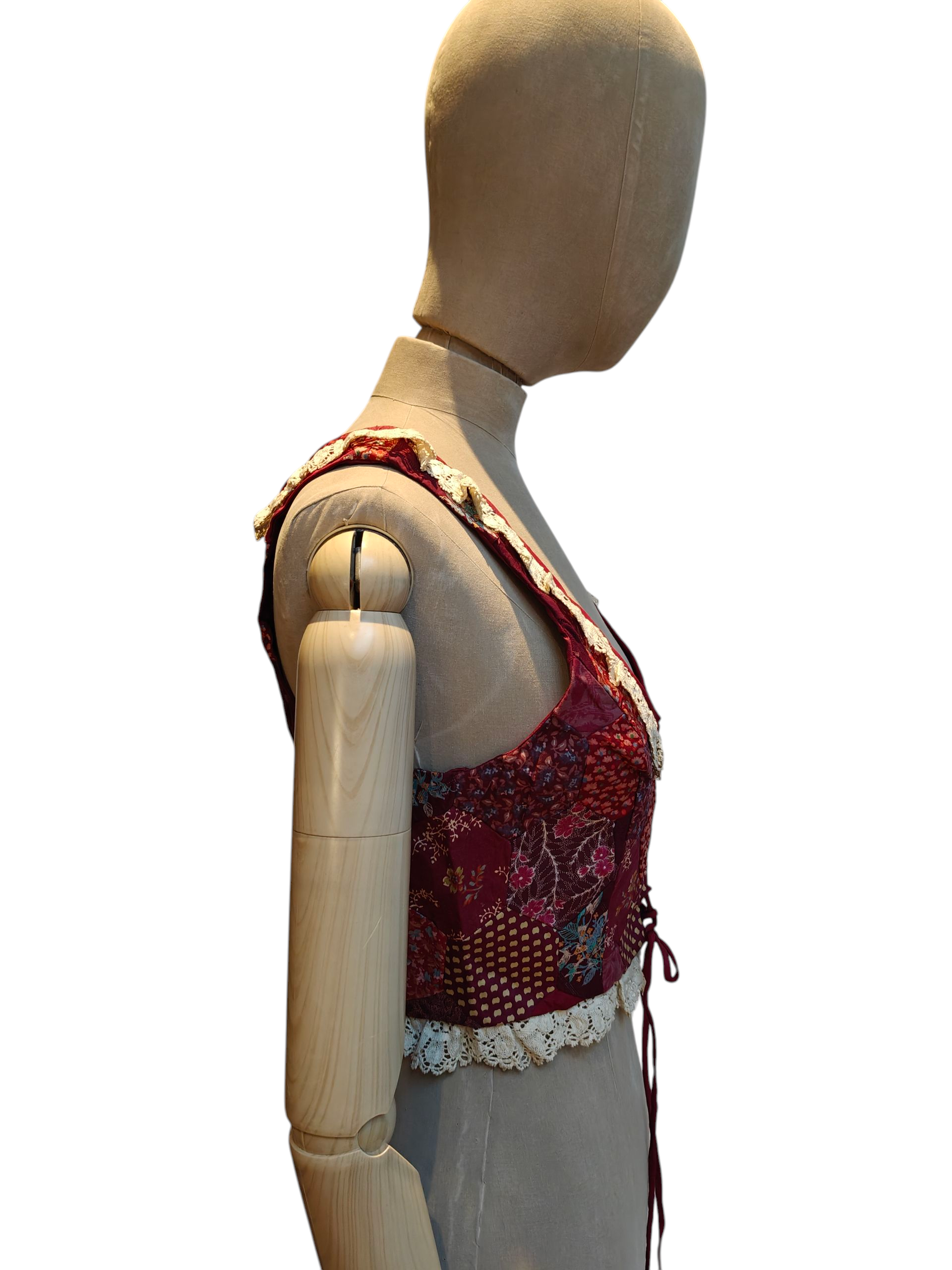 Mannequin wearing a red floral top on a white background