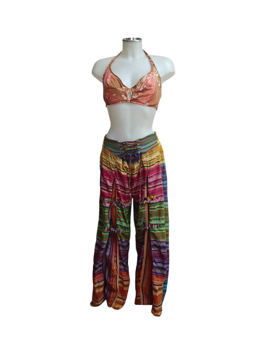 Colourful harem pants and top set on a mannequin against a white background