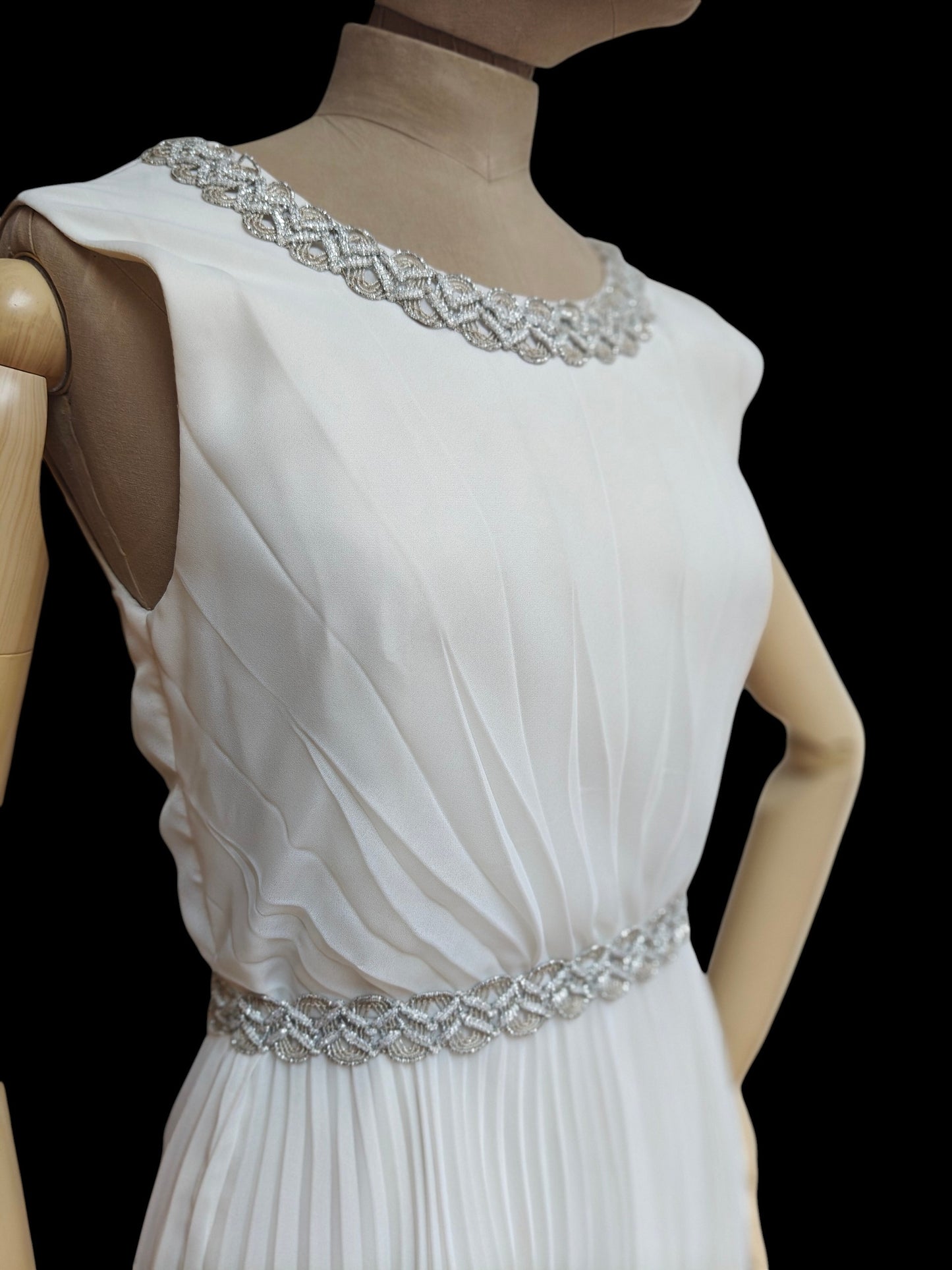 white pleated wedding gown with silver waistband