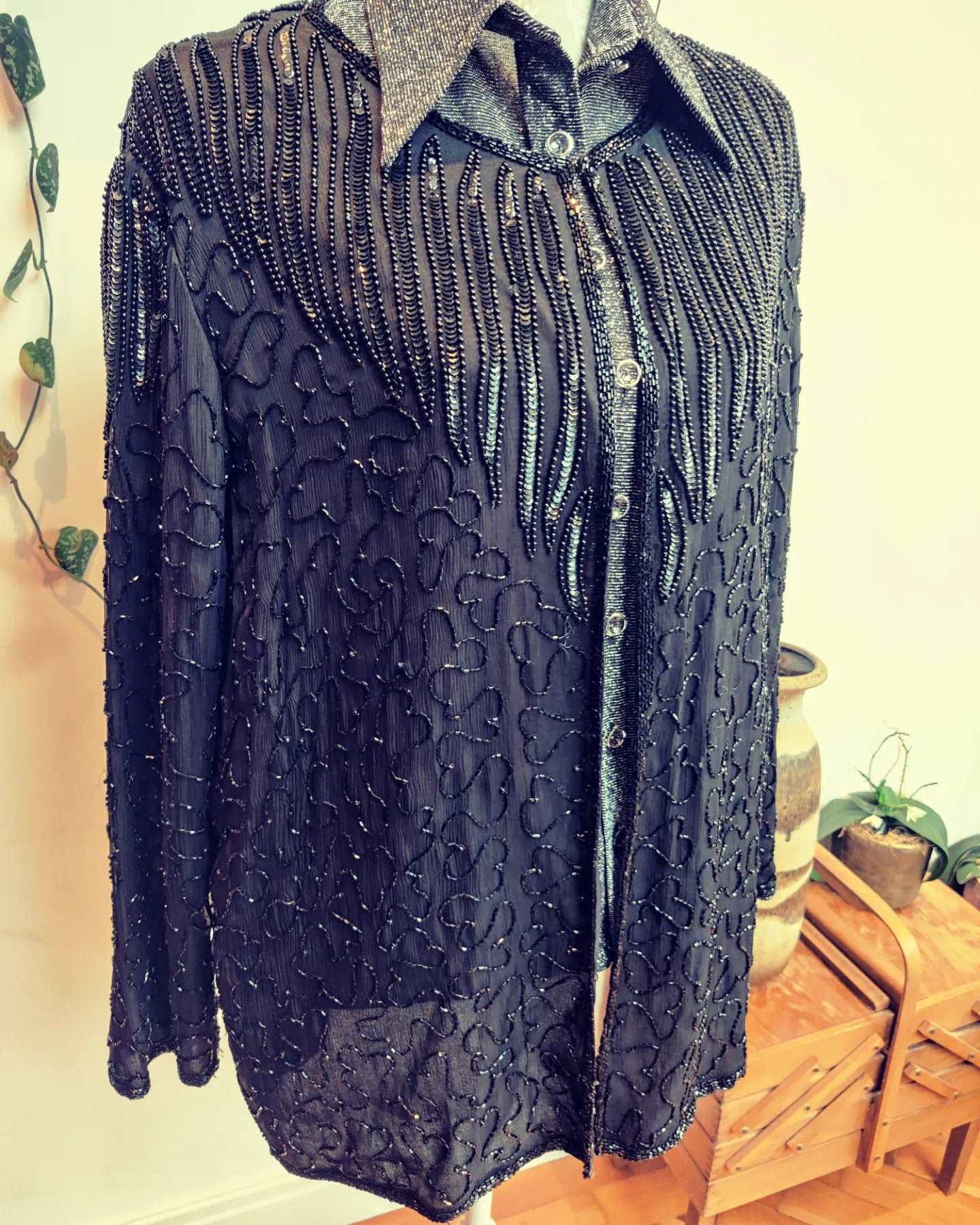 black sequin jacket with front hook and eye fastening. size 14-18.