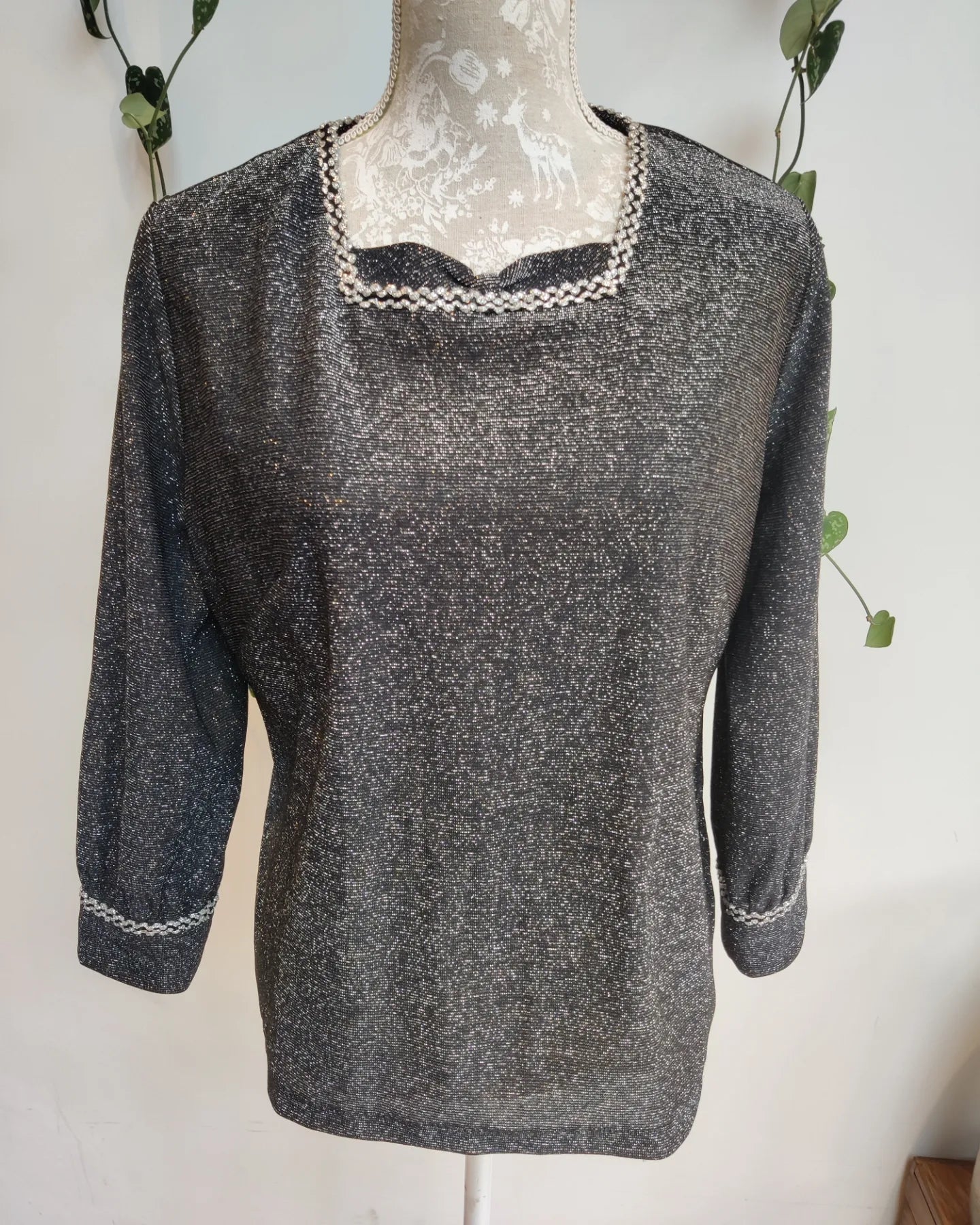 Sparkly silver lurex top in a size 16.