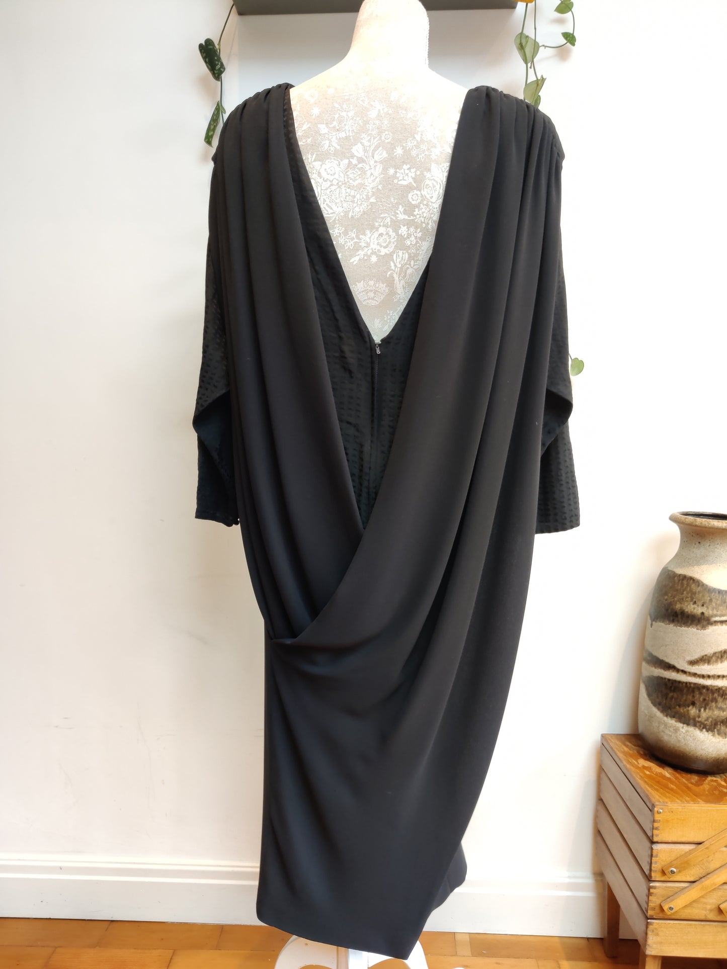 Stunning vintage black dress with cape like drape back. Size 12-16.