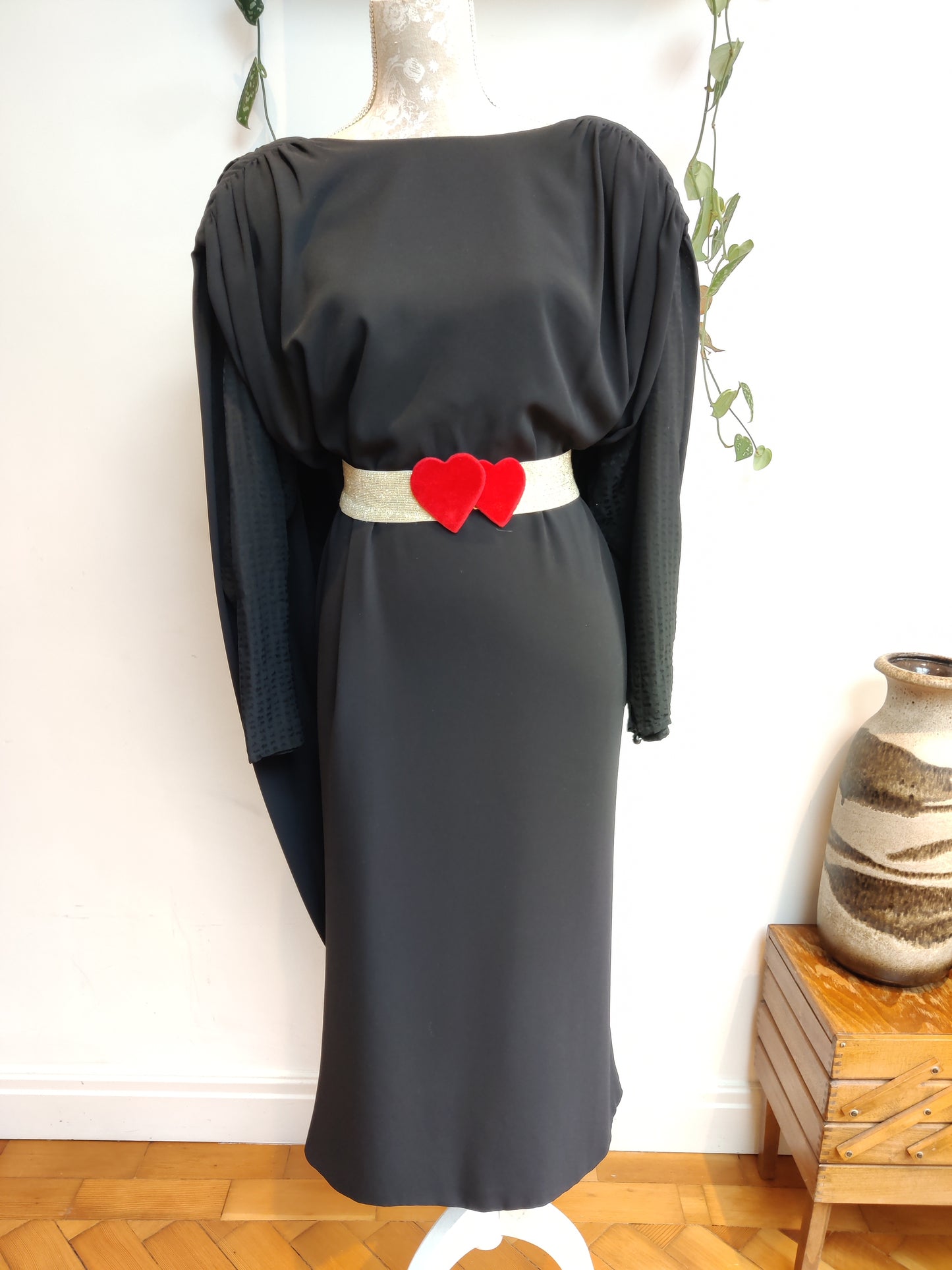 Stunning vintage black dress with cape like drape back. Size 12-16.