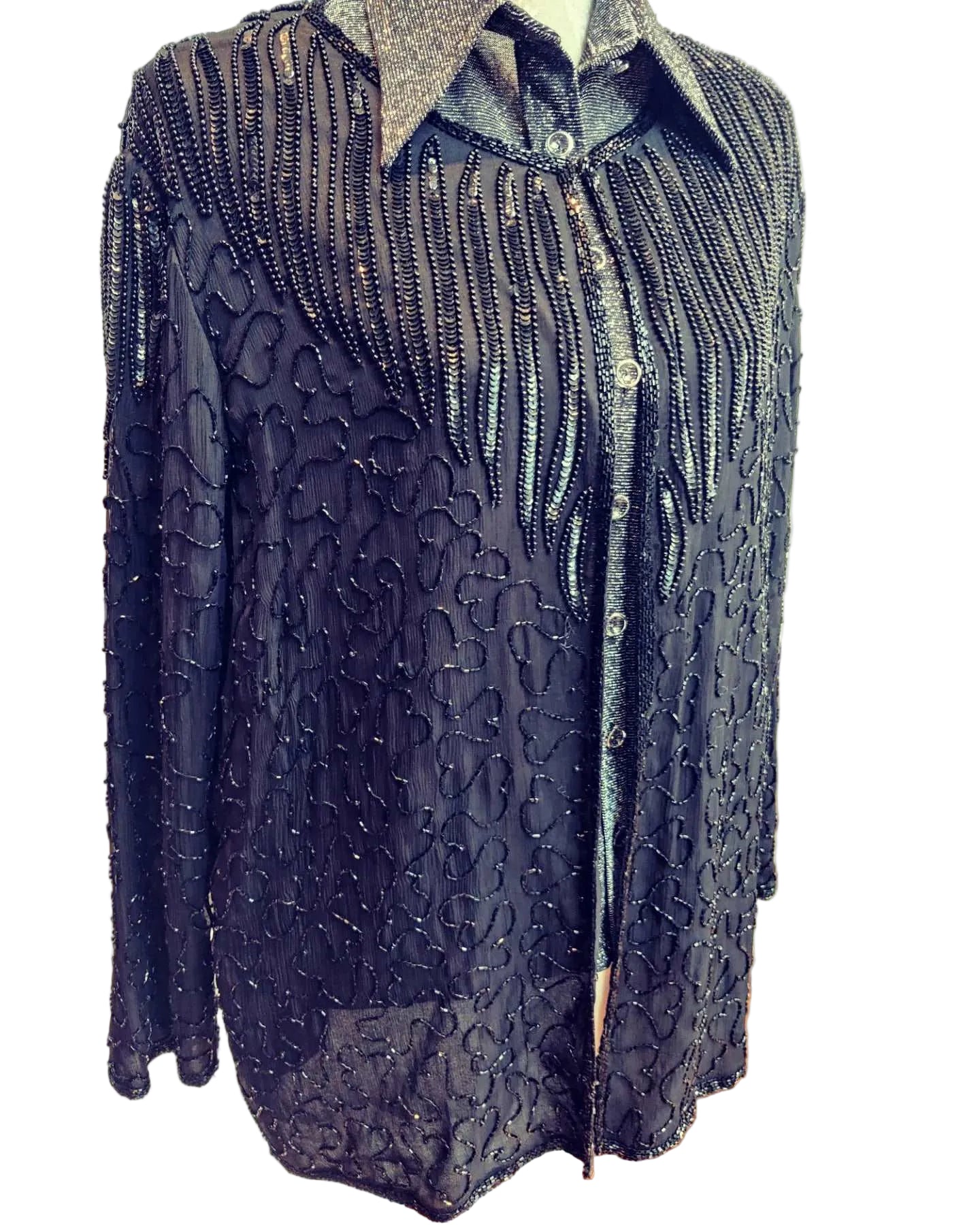 black sequin jacket with front hook and eye fastening. size 14-18.